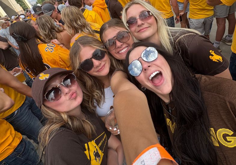 author and their friends at a uw football game