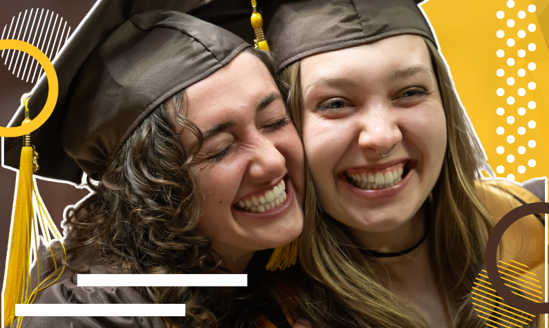 two students celebrate graduation from UW.