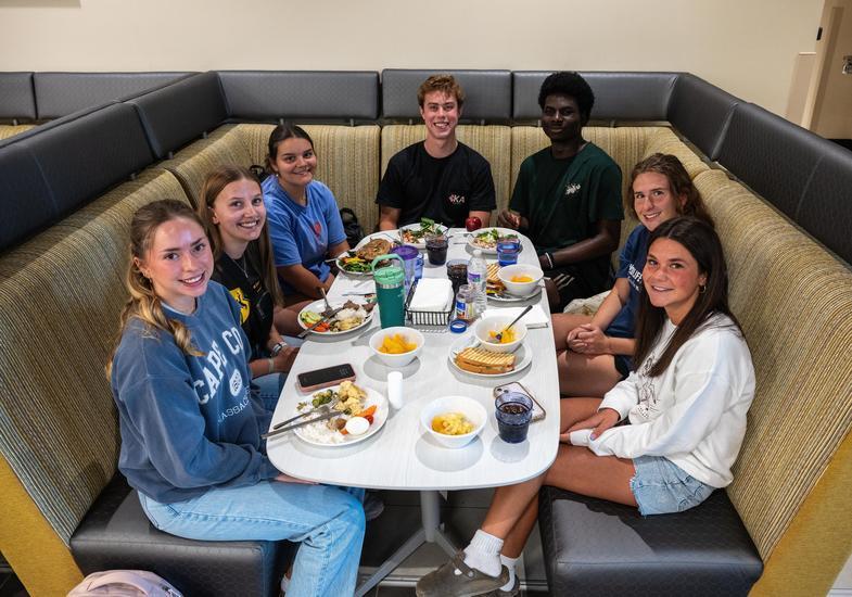 students enjoy a meal in the dining center