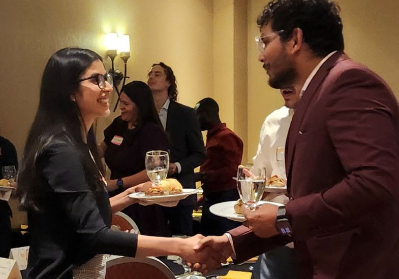 student mingle before dinner