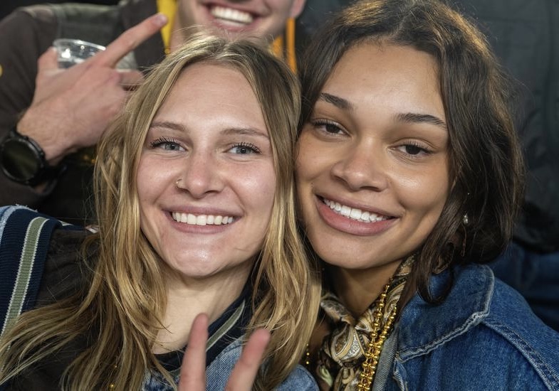 Mariah and a friend at a football game