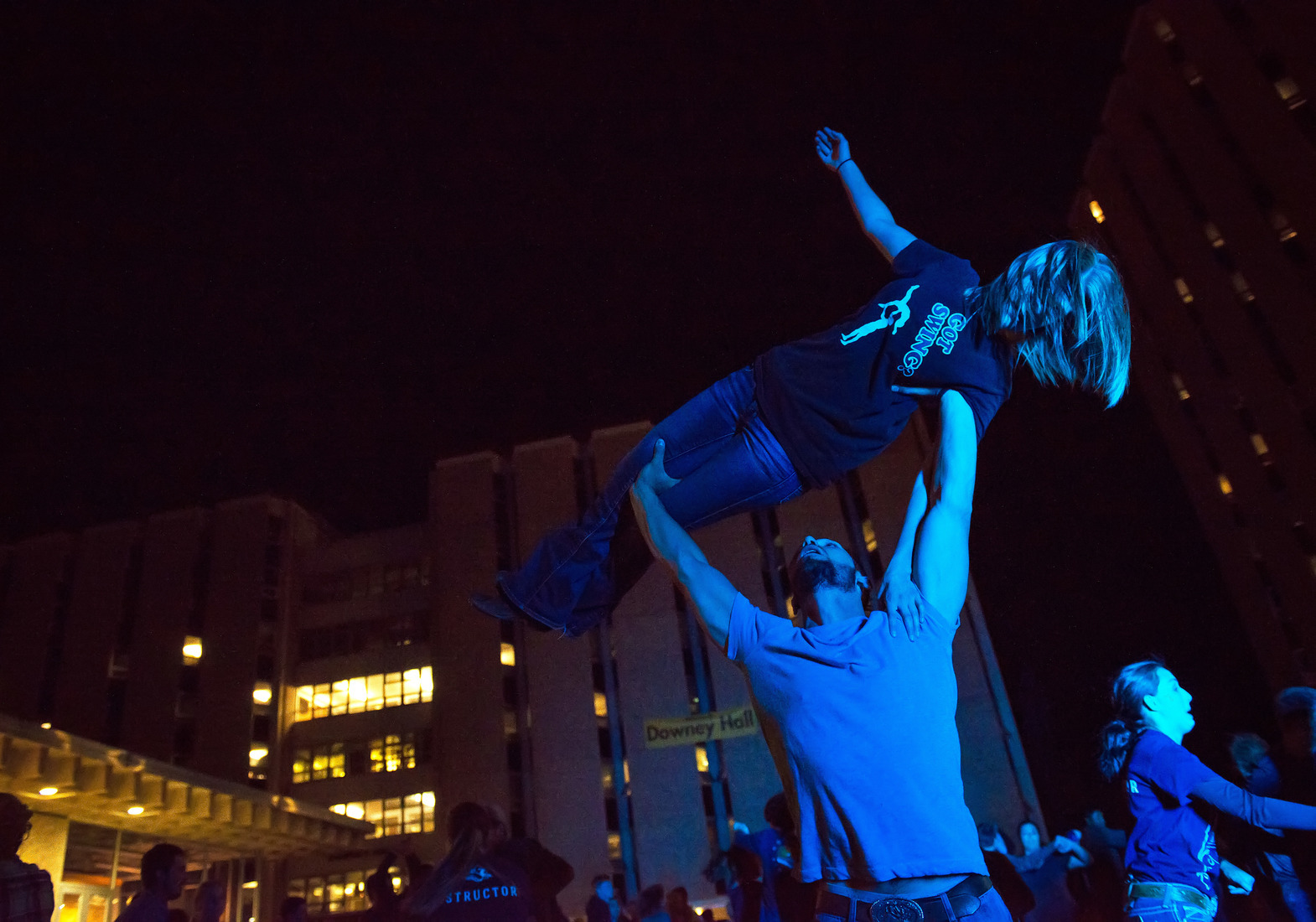 two students do a lift in cowboy country swing dance club