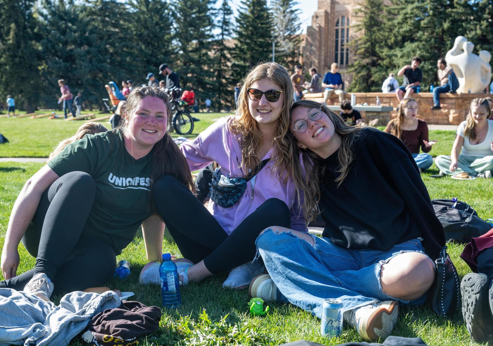a group of friends enjoys a sunny day and live music on Prexys