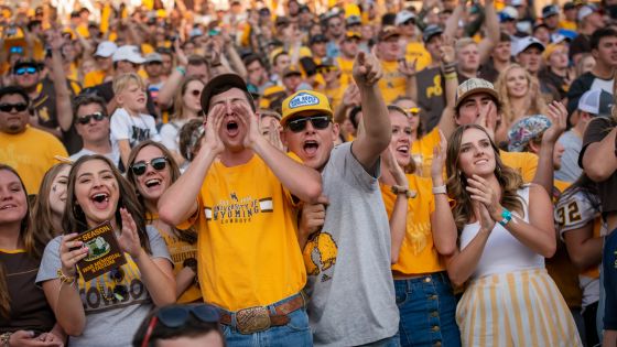 Students cheering a football game