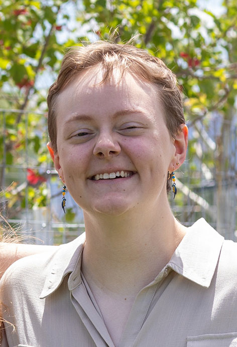 Picture of smiling person with short hair.