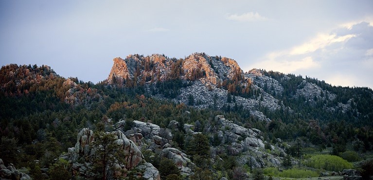 A button with an image of Medicine Bow Peak that leads you to the WyoCloud page