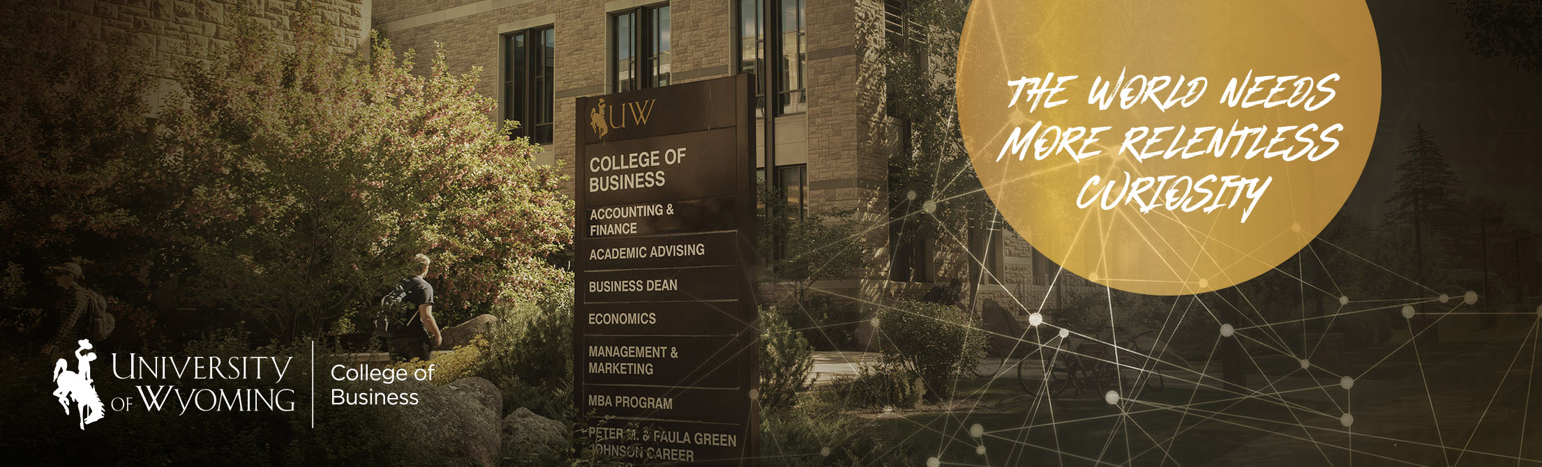 College of Business building with student walking in front