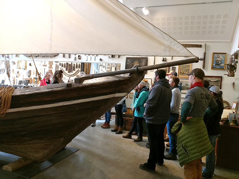 Students looking at boat on study abroad trip