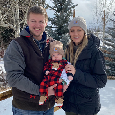 John pictured with wife and child