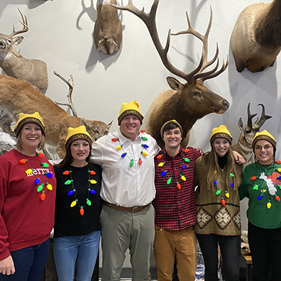 Tanner with festive coworkers