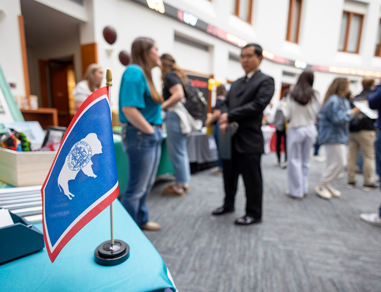Wyoming state flag displayed on table during College of Business career fair
