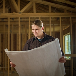 Jon Gardzelewski examines blueprints for a zero-energy home