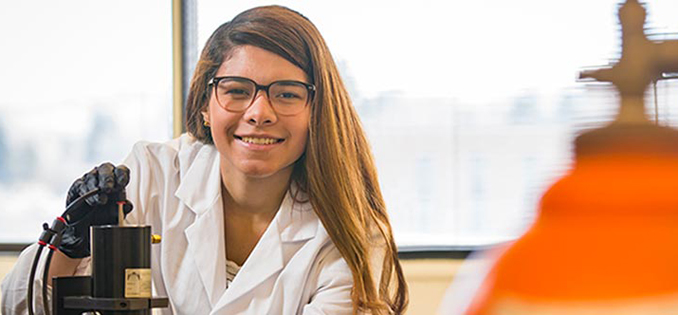 female student smiles at camera