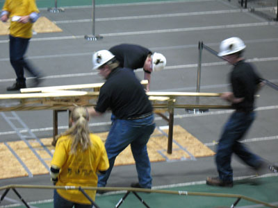 Students working on bridge competition  - moving into place
