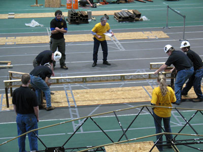 Students working on bridge competition - starting to place in portions of the structure