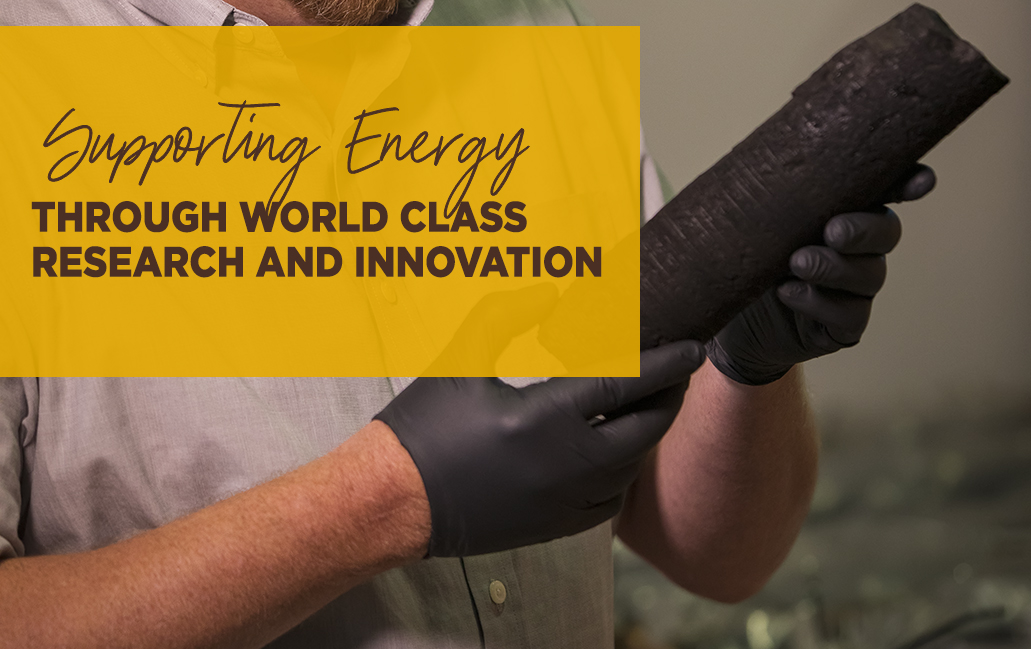 hands holding a core sample with text that says supporting energy through world-class research and innovation.