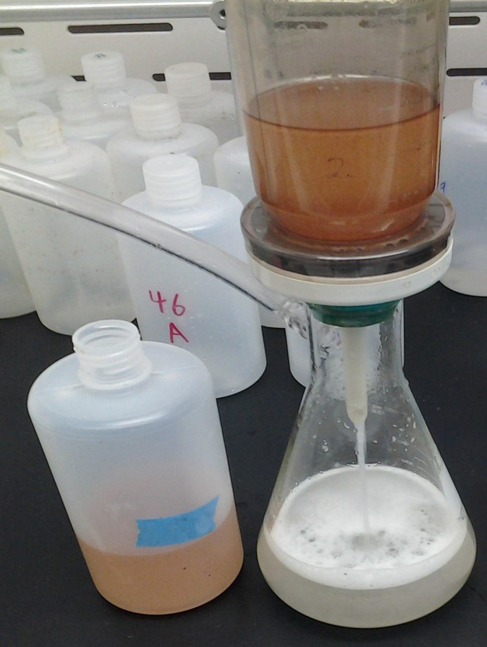 Produced water sample going through filter