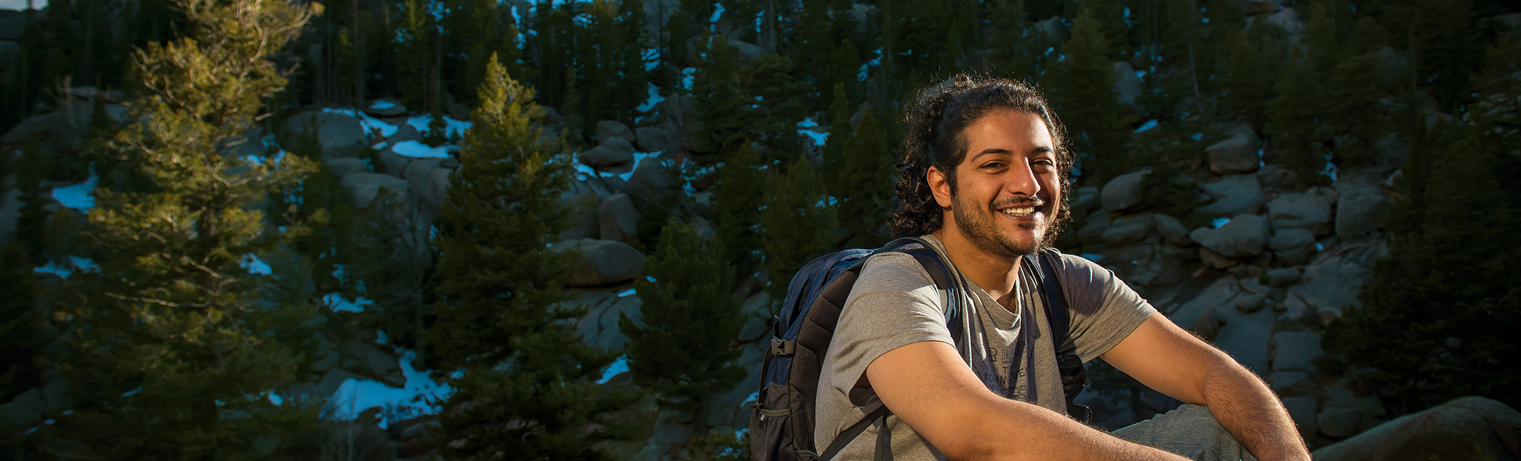 A petroleum engineering student poses for a portrait in Vedauwoo near Laramie.