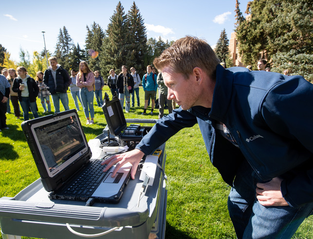 Student at computer outside
