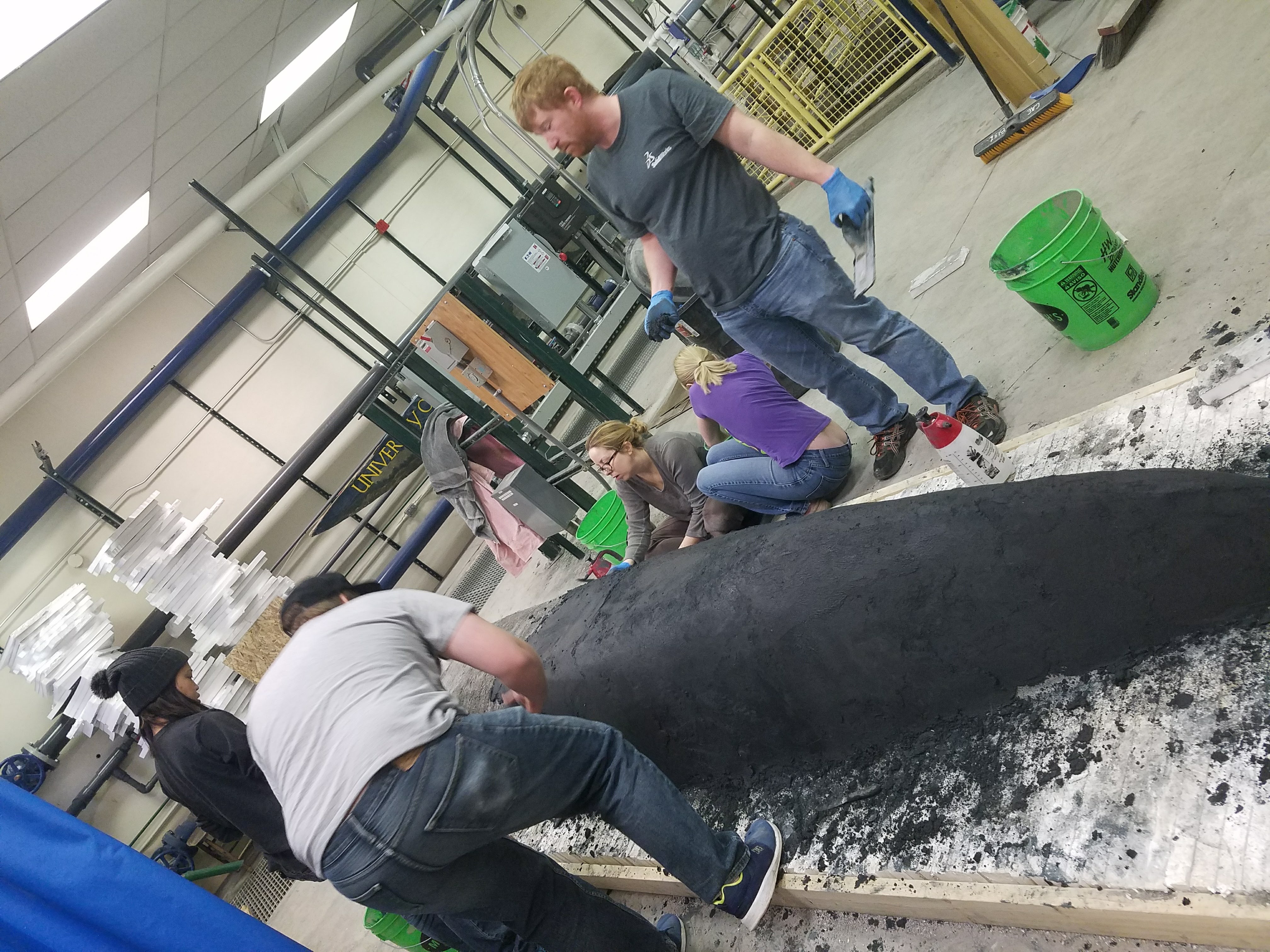 students working on bridge