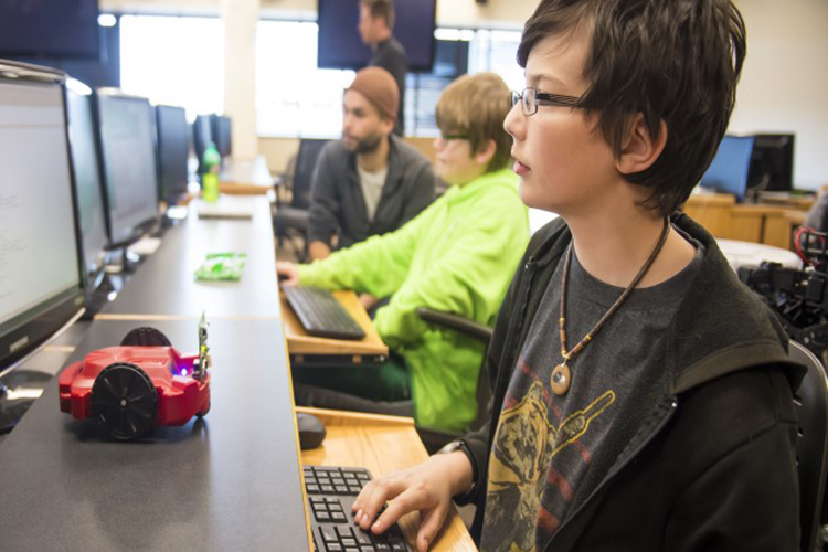 student works on a computer