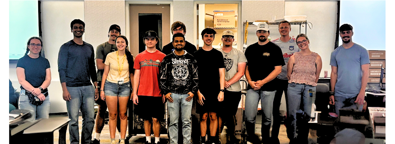 Group of college students standing in a line