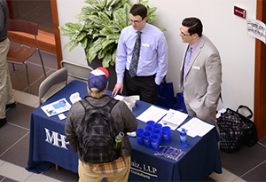 Student Talking at Booth at Job Fair 