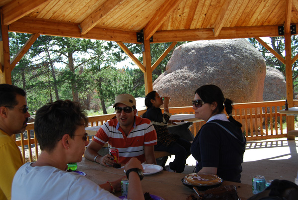 Students talking at picnic table