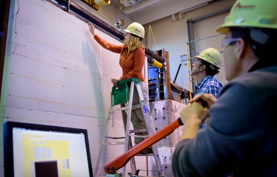 A student tests building materials in the Engineering Building. 