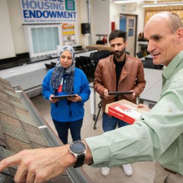 Roofing is an integrated component taught in the CM laboratory, where students are introduced to the fundamental components of roof structures. Associate Professor Francois Jacobs’ Construction Management Lab. Sahar Sewaid (blue top), Yemen; Mohammad Karman (brown jacket), Pakistan; Carter Lobatos (light-colored hoodie, hat)
