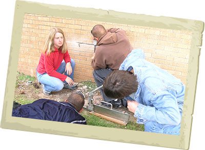 Jenny with students outside a building