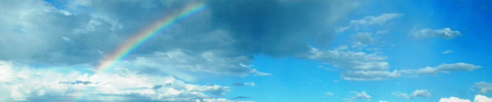 Rainbow in blue sky