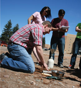 Shawn Griffiths teaching outside in dirt
