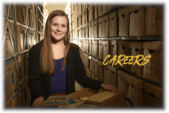 female student looking at material in an archive