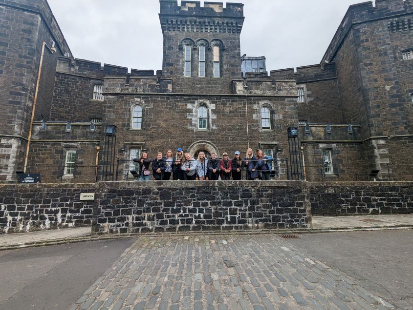 Students in front of historic prison in Scotland