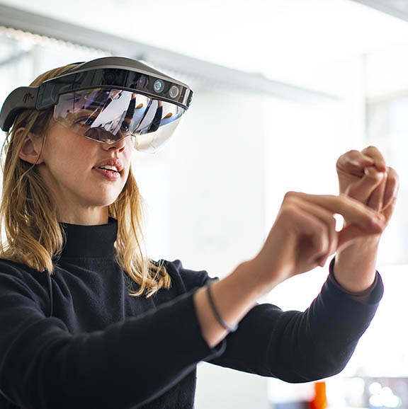 A woman wears a virtual reality headset