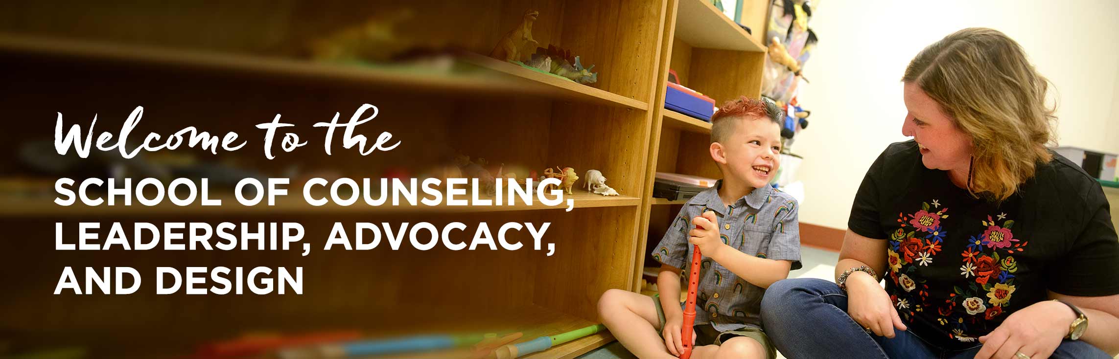 Counseler with play therapy, with wording: Welcome to the School of Counseling, Leadership, Advocacy, and Design
