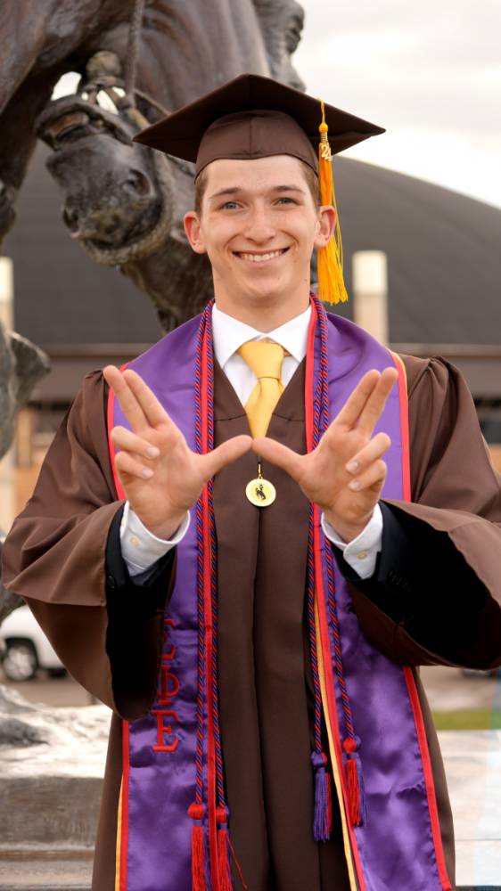 Student smiling at graduation