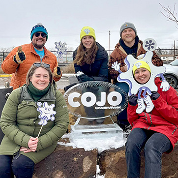 COJO Winter Fest 2025, a group of faculty and students smiling