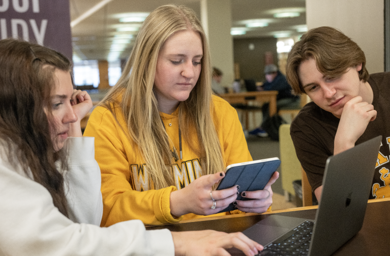 Students together in a college study area.