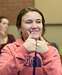 Student learning to use sign language.