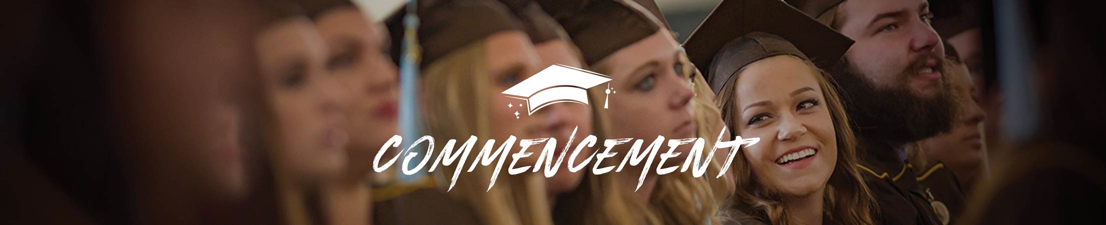 faces of students at commencement, University of Wyoming
