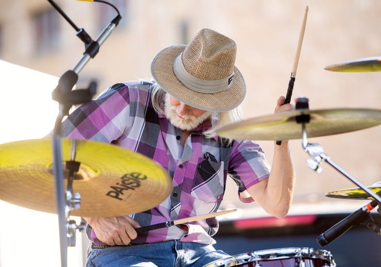 A drummer plays music at a UW Welcome Back Barbeque hosted by 7220 Entertainment