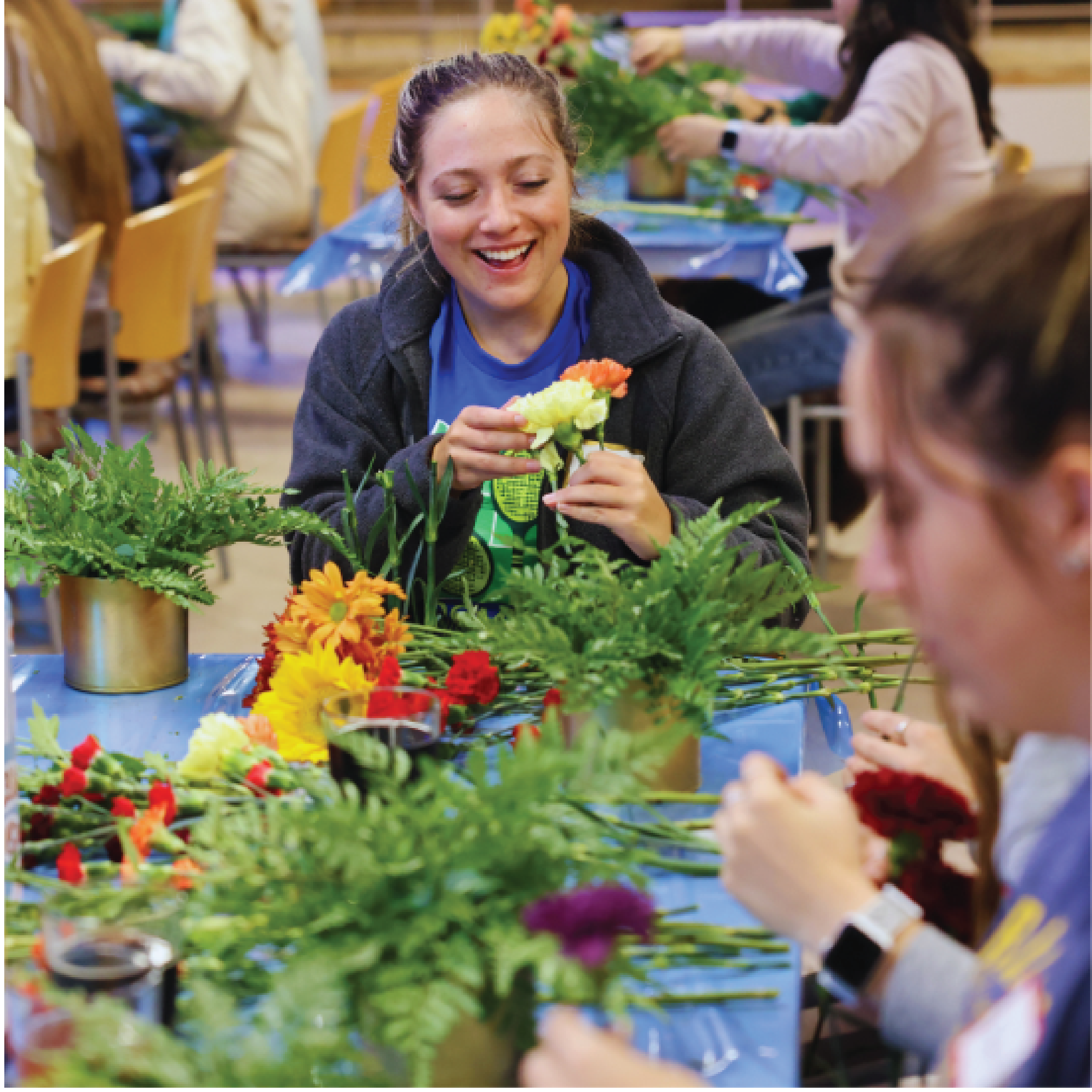 student at flower arranging event