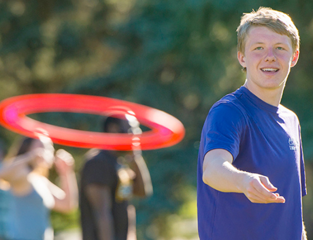 Student throwing a frisbee