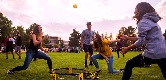 A group of UW students play spikeball at a University of Wyoming event