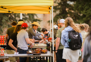 UW students line up outside of student organization booths for an event on Prexy’s Pasture