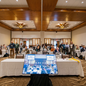 a crowd gathers for a speaker event