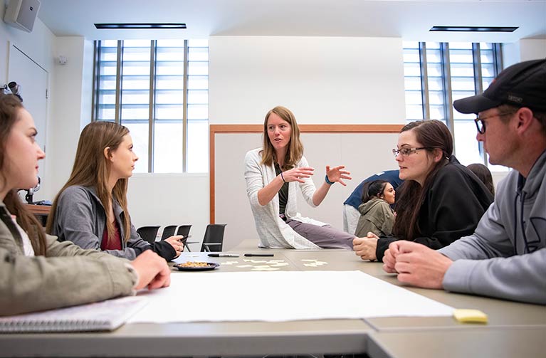Professor talking to students
