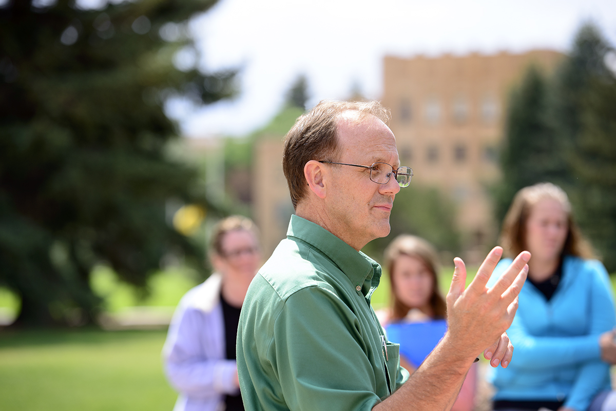 UW instructor teaching outside to a group of students 